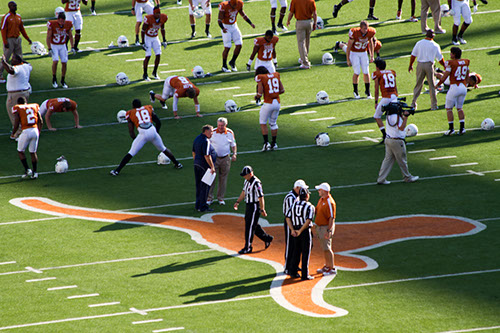 College football players in pre-game warmups