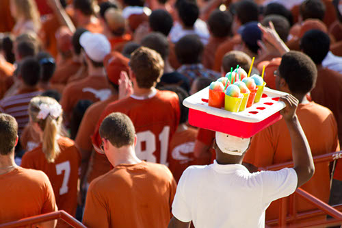 Vendor selling slushies amongst the spectators