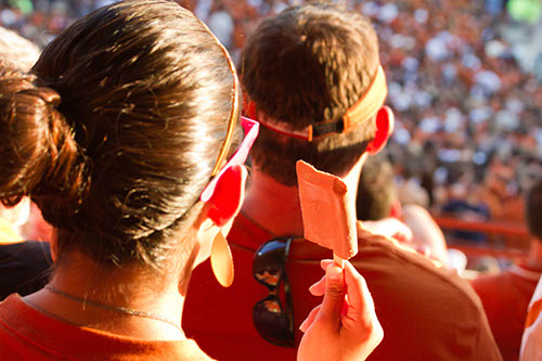 Fan eating chocolate popsicle